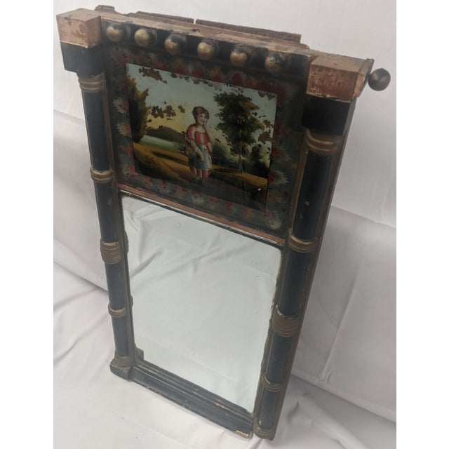 A charming and increasingly scarce Empire/Biedermeier wall mirror dating to circa 1830–1845, featuring an original...