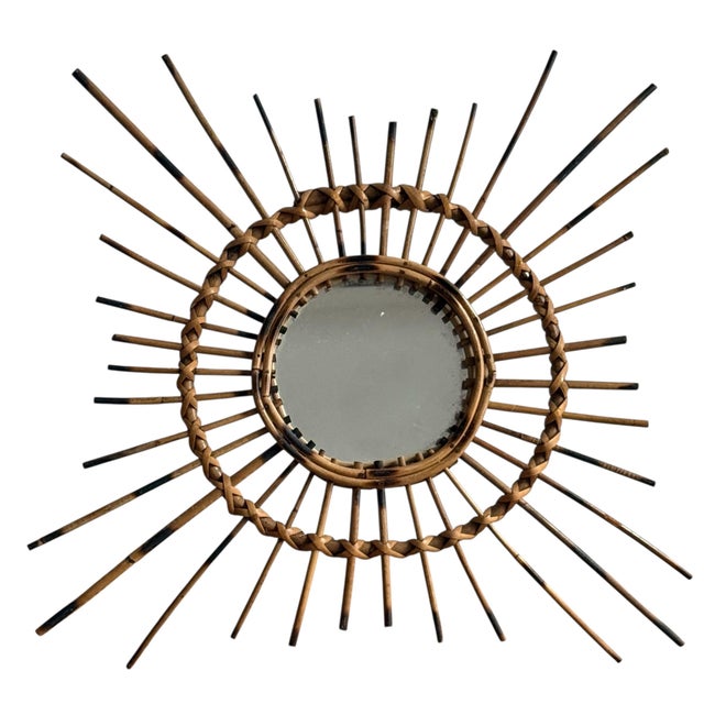 Rattan sunburst mirror from the 1950s. The mirror is original, handcrafted in the south of France.