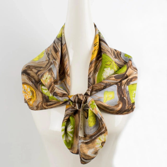 Elegant silk scarf by Jeanne Lanvin and Castillo in brown and green colors featuring an intricate flower pot design print...