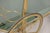 An elegant Italian bar cart from the 1970s, featuring a refined brass frame with a bamboo-effect pattern and smoked...