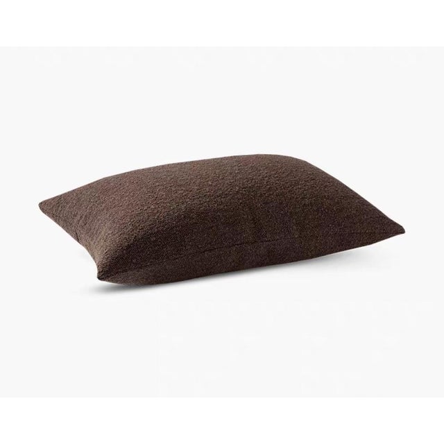 This modern pillow is carefully wrapped in high-end designer fabric, presenting a soft off-white hue with delicate texture...