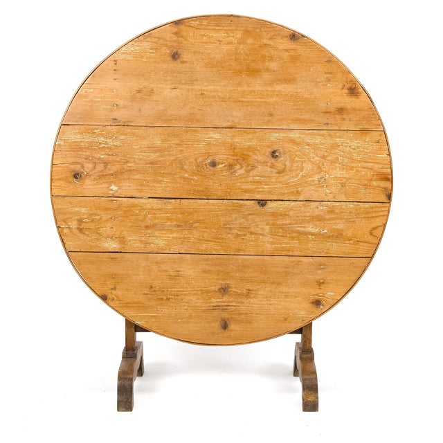 A beautifully timeworn 19th century English pine wine table, distinguished by its honest construction and rich patina...