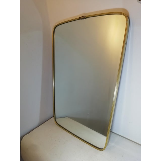 Vintage mirror with brass frame, made in Italy during the heyday of design. Thick brass frame and high-quality glass. Good...