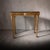 Exquisite French gilt wood console table with black marble top in the style of Luis XVI. The gilt wood features beautiful...