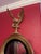 This decorative wall mirror features a classic Federal style design, characterized by a gold finished eagle crest perched...