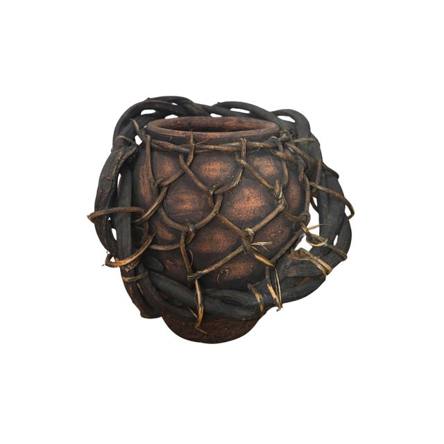 Add a truly unique, earthy statement piece to your space with this handmade rustic clay vase wrapped in an organic woven...