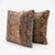 This 24'' x 24'' pillow cover set was made from authentic Turkish rug pieces — vertical faded bands in terracotta and blue...