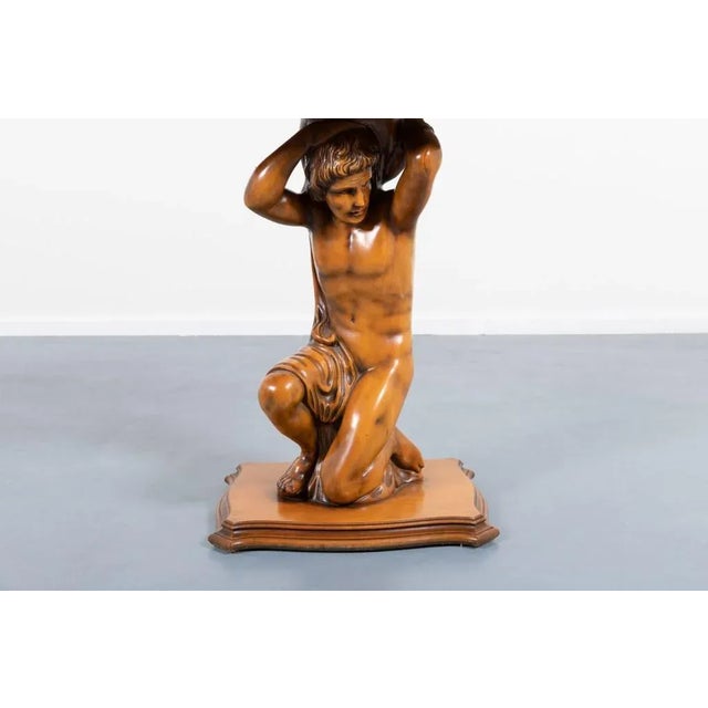 Sculptural base table from 1970s, Italian craftsmanship with unique design. The table has a hand crafted wooden base with...