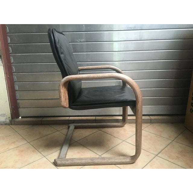Vintage armchair - chair with black natural leather armrests. Everything in its original condition. Minor superficial...