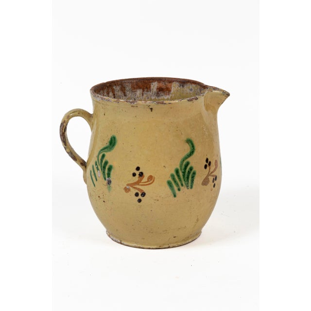 Antique Savoyard Pitcher, France, Late 19th Century. Warm yellow base with applied slip design, typical of the Savoie region.
