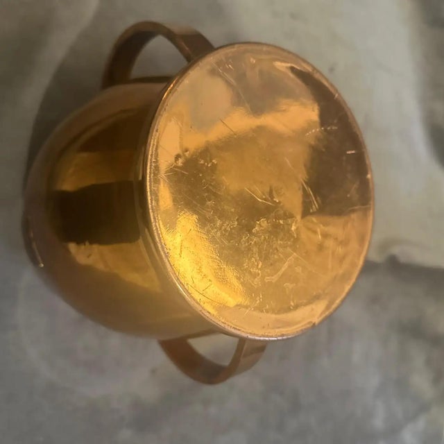 This striking 1950s Mid-Century Modern Italian wine cooler also usable as ice bucket is crafted from highly polished...