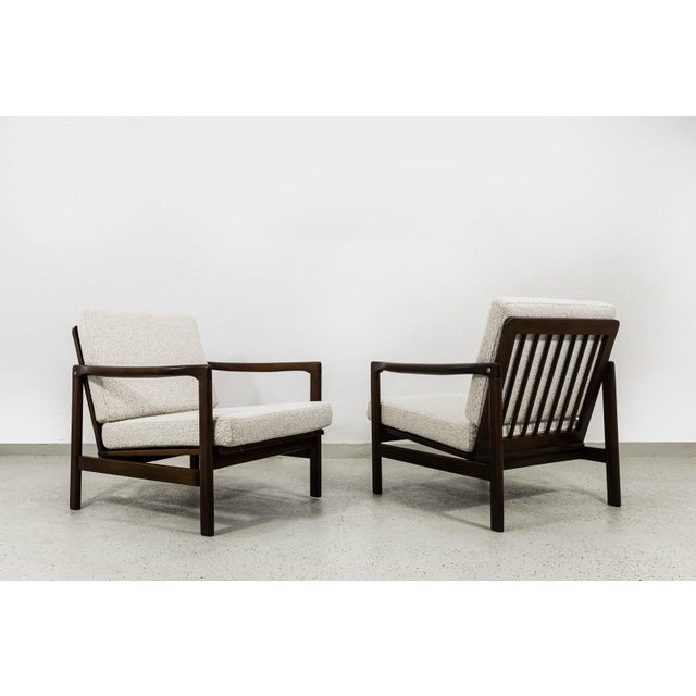A pair of B7522 club armchairs, designed by Zenon Bączyk, manufactured in Poland in the 1960s. The vintage club armchairs,...