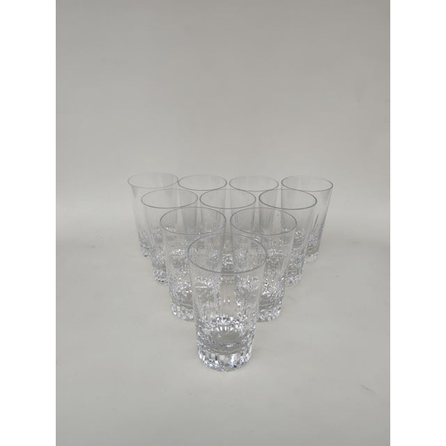 Ten Baccarat crystal tumblers, Cassino pattern. Circa 1970. Height 12 cm. All glasses are signed. A very elegant beveled...