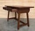 A charming early 20th century Spanish pine farm table with four legs and back side trestle and a wonderfully well-worn...