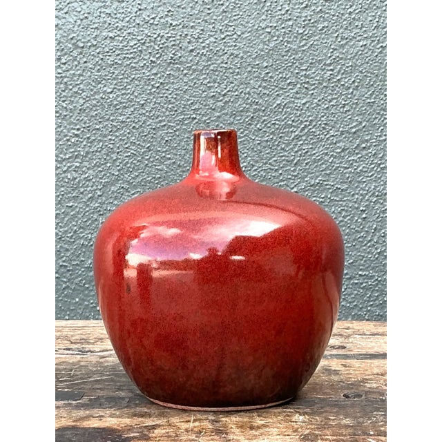 Vintage Red Glazed Ceramic Vase brings a sculptural, traditional accent to a tabletop, shelf, console, or mantel. Its...