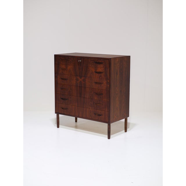 This very rare chest of drawers from 1960s Denmark is attributed to Henry Rosengren Hansen and reflects the refined...