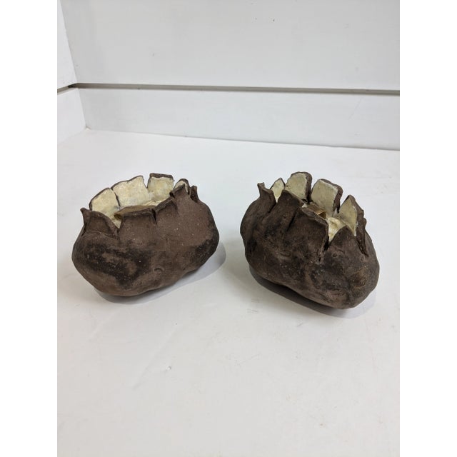 Add a whimsical touch to your home decor with this charming pair of artist-signed ceramic baked potatoes! Crafted with...