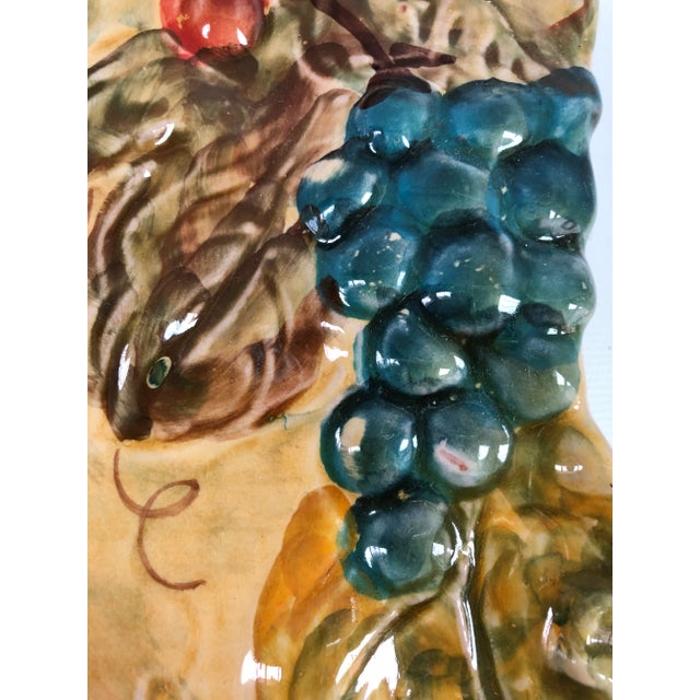 Vintage Italian hand-painted in bold colors rectangular wall plate with grape motif in relief. Maker's mark on underside.
