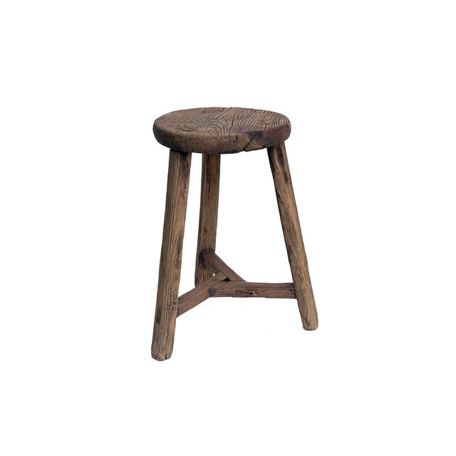 This is a rustic, handcrafted wooden stool featuring a simple yet sturdy design that exudes timeless charm. The stool has...