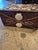 Standout 19th Century folk art wood box lovingly decorated with exotic seashells in an eccentric composition.