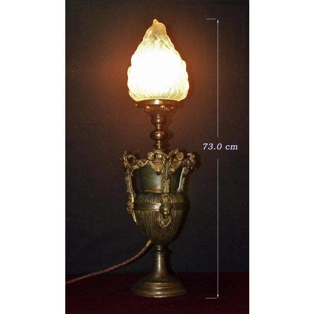 An exceptional and highly sculptural Gothic revival table lamp dating to the 1875, distinguished by its monumental bronze...