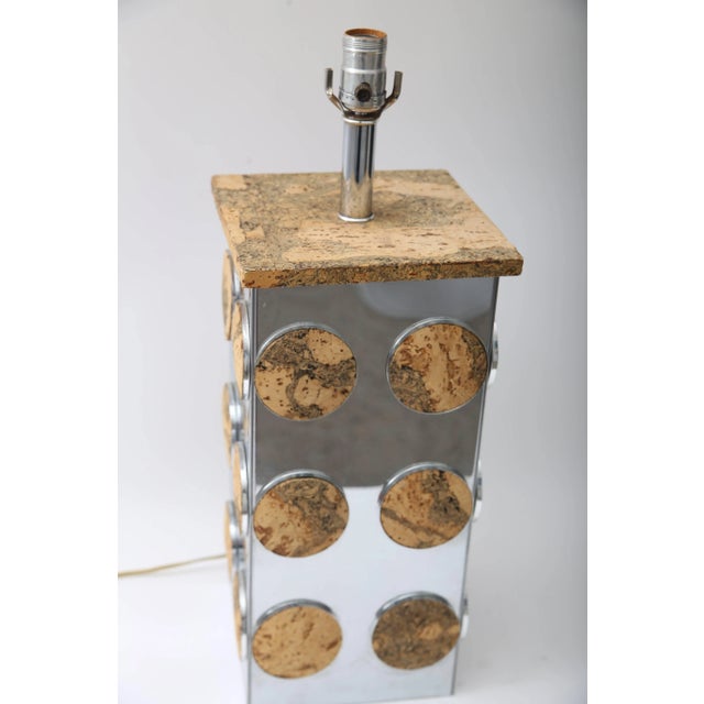 This stylish and chic table lamp dates to the 1970s and is fabricated in cork and polished chrome, in the style of Paul...