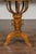 An Austrian Biedermeier period walnut guéridon table from the mid-19th century, with star inlay and scrolling foliage....