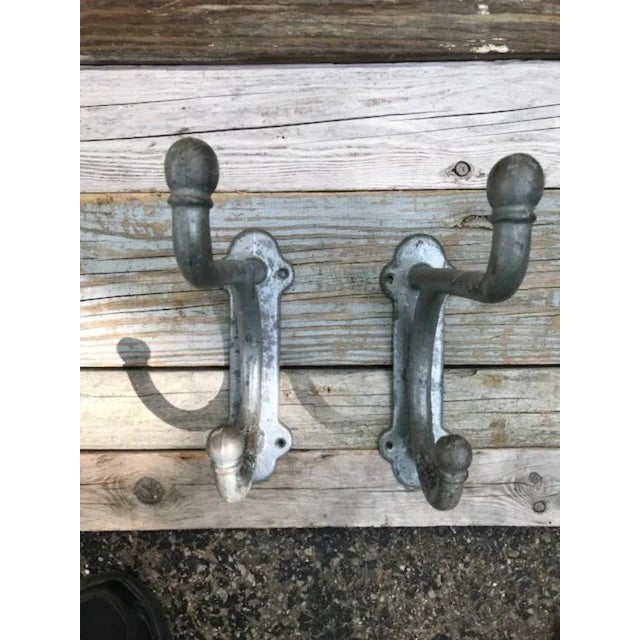 Forged at the legendary Fiske Iron Works of New York, this pair of cast iron hooks with original zinc plating were rescued...