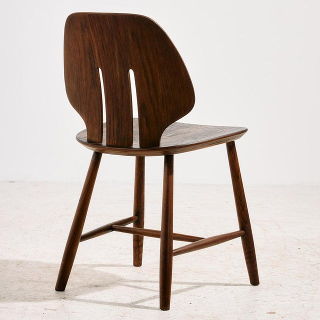 ‘J67’ oak chair designed by Ejvind A. Johansson for FDB Møbler in 1957. The spirit of Danish design lies in the elegant,...