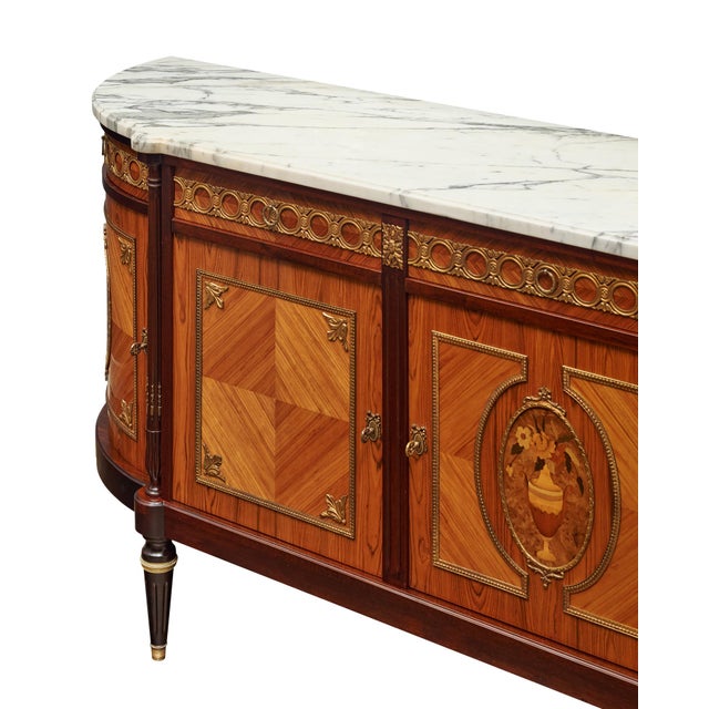 Buffet or enfilade from France made in the Louis XVI style. This piece is made of solid wood construction, primarily...