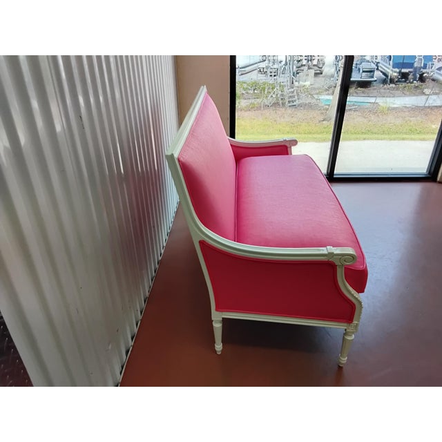 This Wesley Hall Settee is amazing. The frame finish is a high gloss white. The fabric is Lee Jofa Flamingo. I would not...