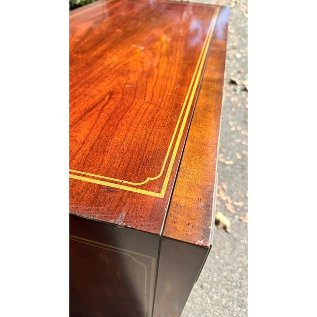 Good vintage condition with minor blemishes consistent with age and use. Brass retains its original patina; drawers glide...