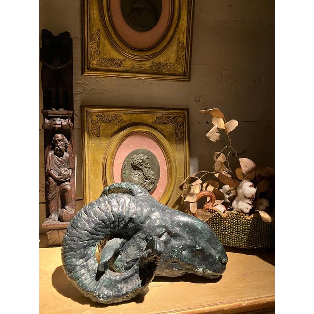 Decorative ram’s head sculpture executed in plaster and finished with a hand-applied green patina intended to evoke the...