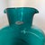 Vintage Blenko Handcraft blown glass pitcher in a striking turquoise-teal color. The sculptural form features a broad...
