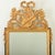 Dimensions: 33 ⅝” H x 19 ¾” W x 1 ½” D A charming music-themed giltwood mirror from France, circa 1870. Topping the piece...