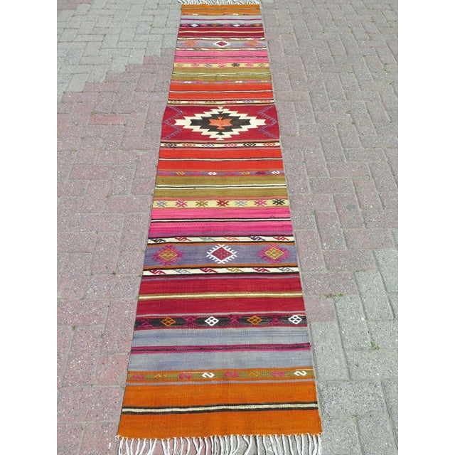 The Runner Rug you are about to purchase is a Vintage Handmade Turkish Rug that is considered a collection piece due to...