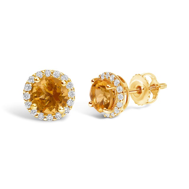 Immerse yourself in the allure of these exquisite 10K yellow gold stud earrings, each centered with a captivating 5mm...