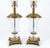 A striking pair of vintage Neoclassical hurricane-style table lamps featuring clear, urn-shaped mouth-blown glass bodies...