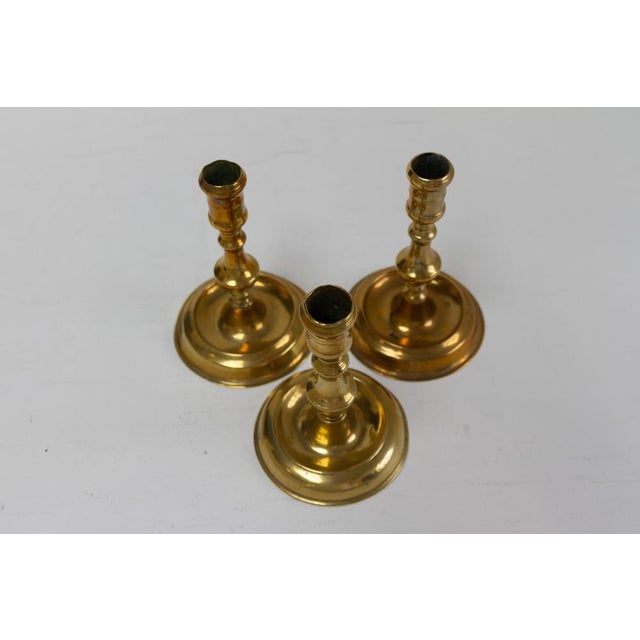 Antique Danish "Næstved" Brass Candlesticks. Set of 3. Set of three baroque candle holders in solid brass from Næstved in...