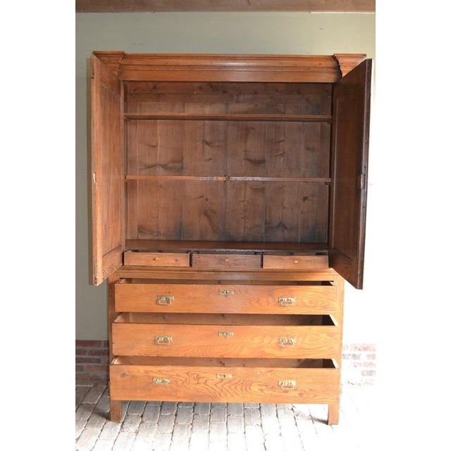 of a 19th-century Dutch oak cabinet. The cabinet is partially removable. The height is 217 cm. The width is 151 cm. The...