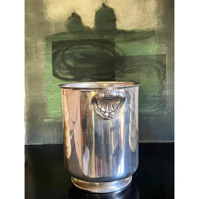Heavy silverplated champagne bucket made in France in the 1950's. The "Ormesson" design has a footed bottom and includes...