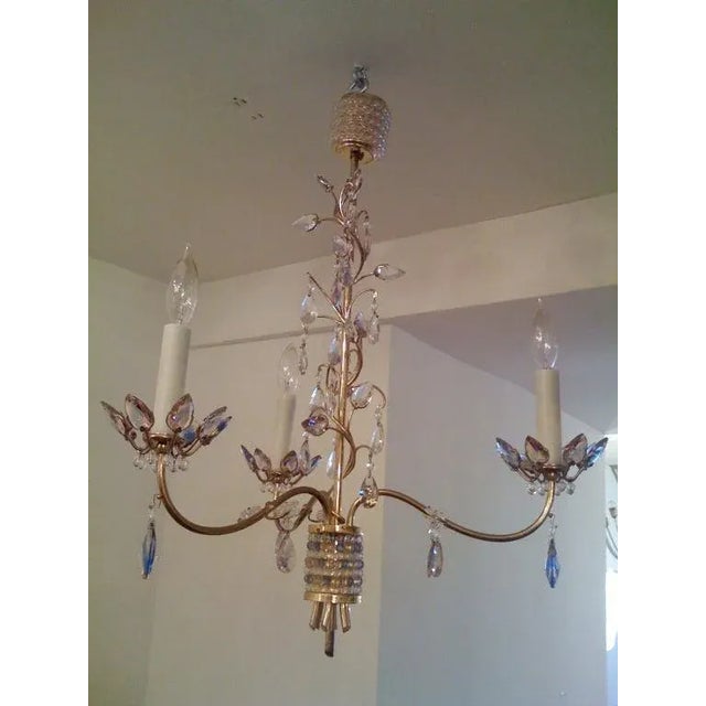A wonderful Austrian jewel toned crystal and brass chandelier designed by Stefan Rath Hardtl for the “Exposition...