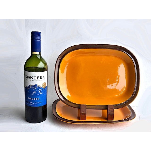 Offered is a set of hand painted ceramic serving pieces designed by Kåre Blokk Johansen and produced by Egersunds...