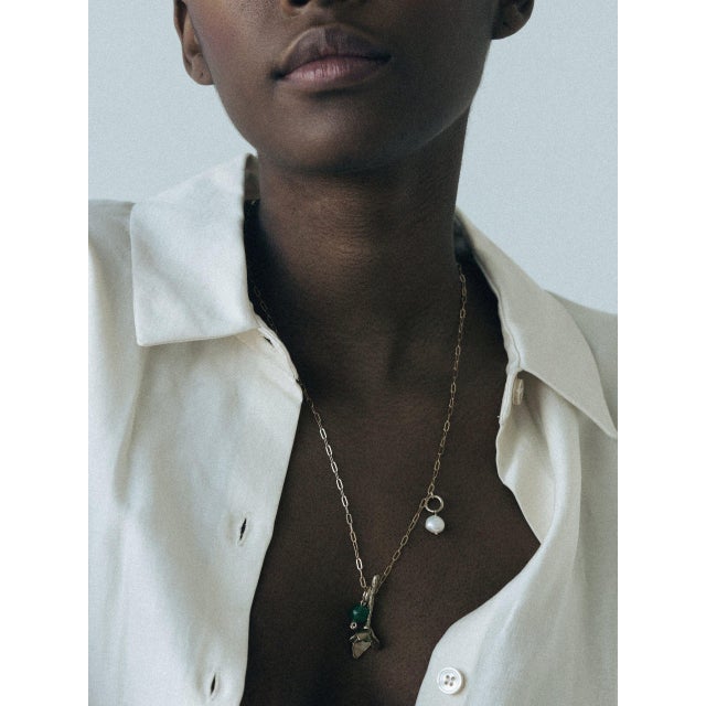 This pendant is a staple for this season. Materials: Hand-carved from wax hangs an 18K Gold Plated Brass Tulip Flower...