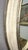Vintage Neoclassical Oval Wall Mirror W/ Silver Leaf For Sale - Image 4 of 5