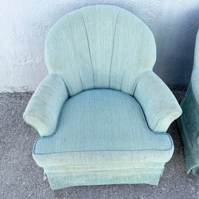 Fantastic pair of vintage Stanley Furniture swivel lounge chairs featuring dramatic scalloped clamshell backs and soft...