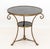 Pair of French Empire Style Marble and Brass Gueridon Tables, each with circular black marble top above three scroll...