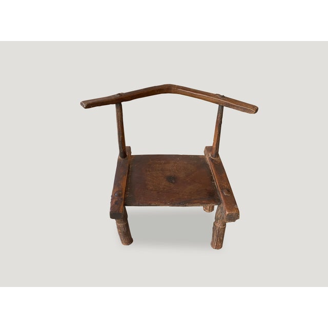 Beautiful patina on this 19th century hand carved wooden chair from the Ivory Coast of Africa. This can also be used as a...