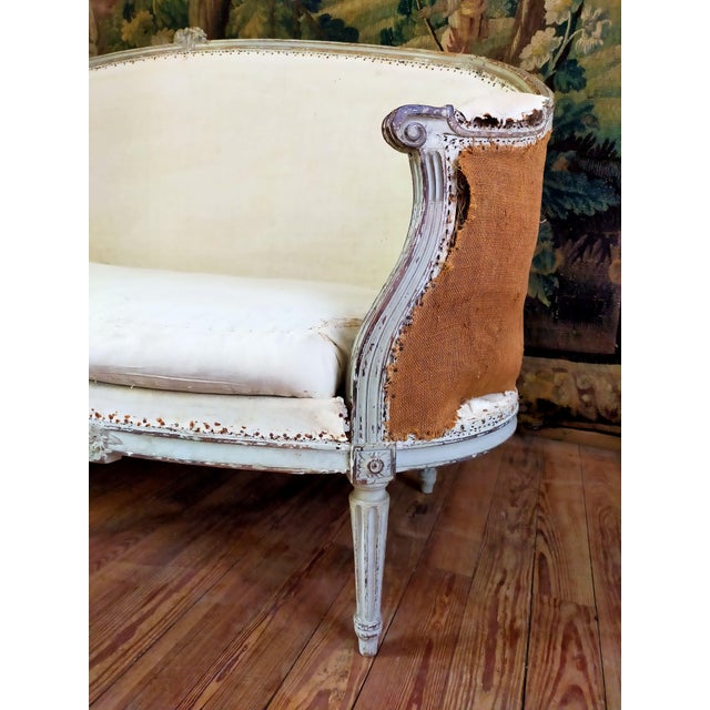 Louis XVI "Corbeille" sofa from the 18th century, in original grey lacquered wood. The Louis XVI design is classic and...