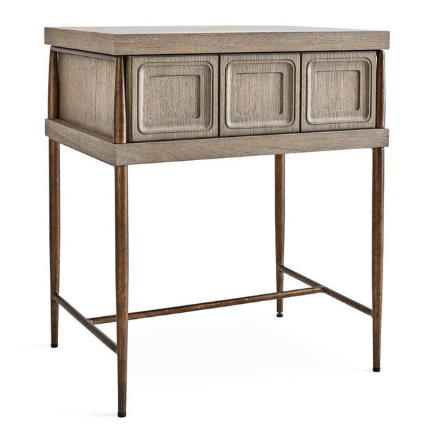 This nightstand brings an artful, architectural quality to the bedside with its sculptural carved drawer front and...